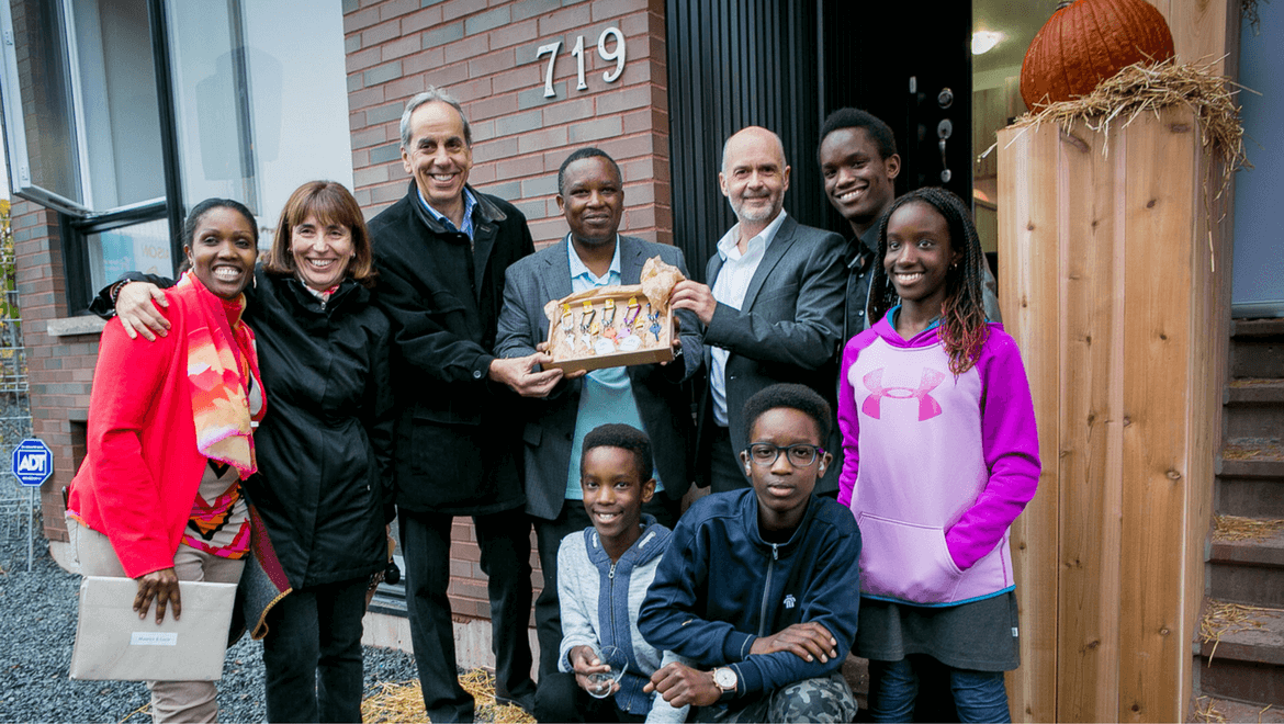 HABITAT FOR HUMANITY FAMILY ENTERS NEW HOME